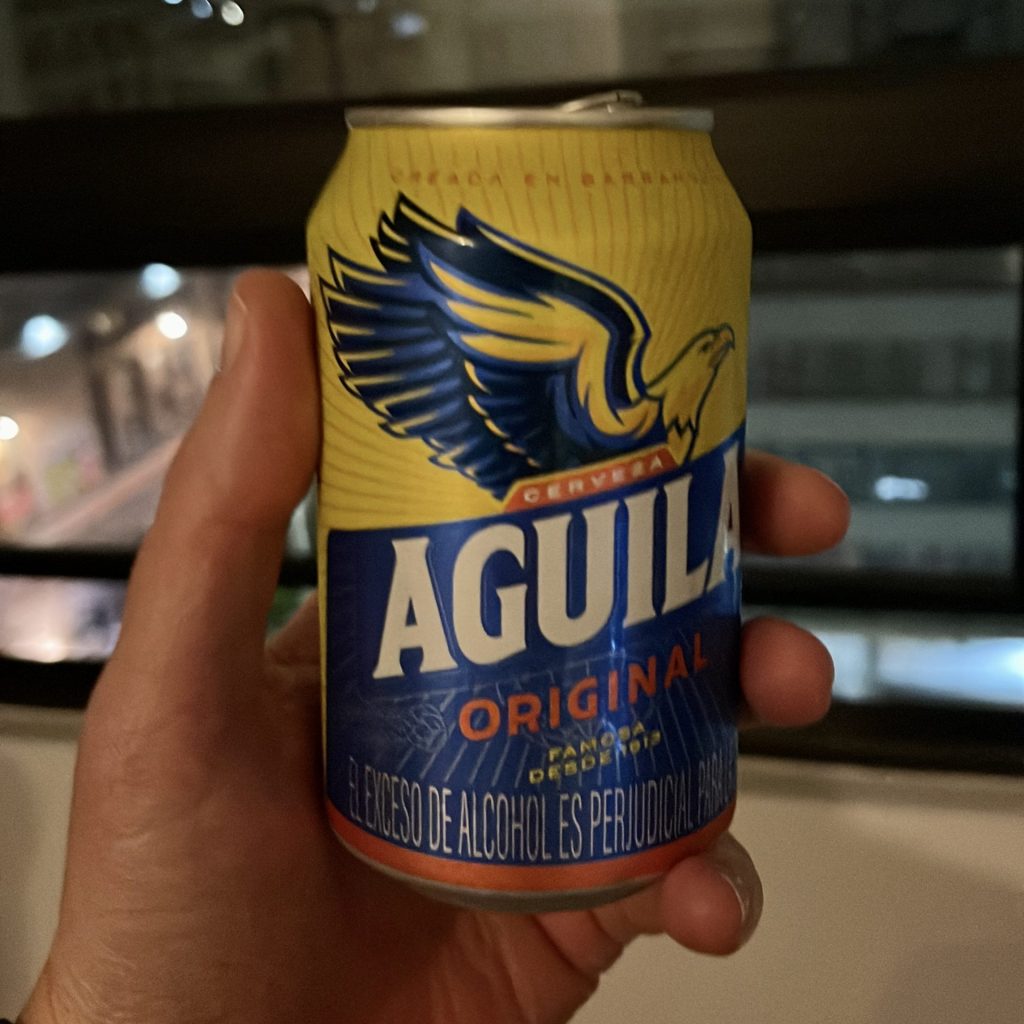 Drinking Aguila on street in Bogota Colombia