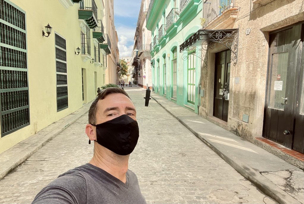 Kieran walking through the colorful streets of Havana, Cuba