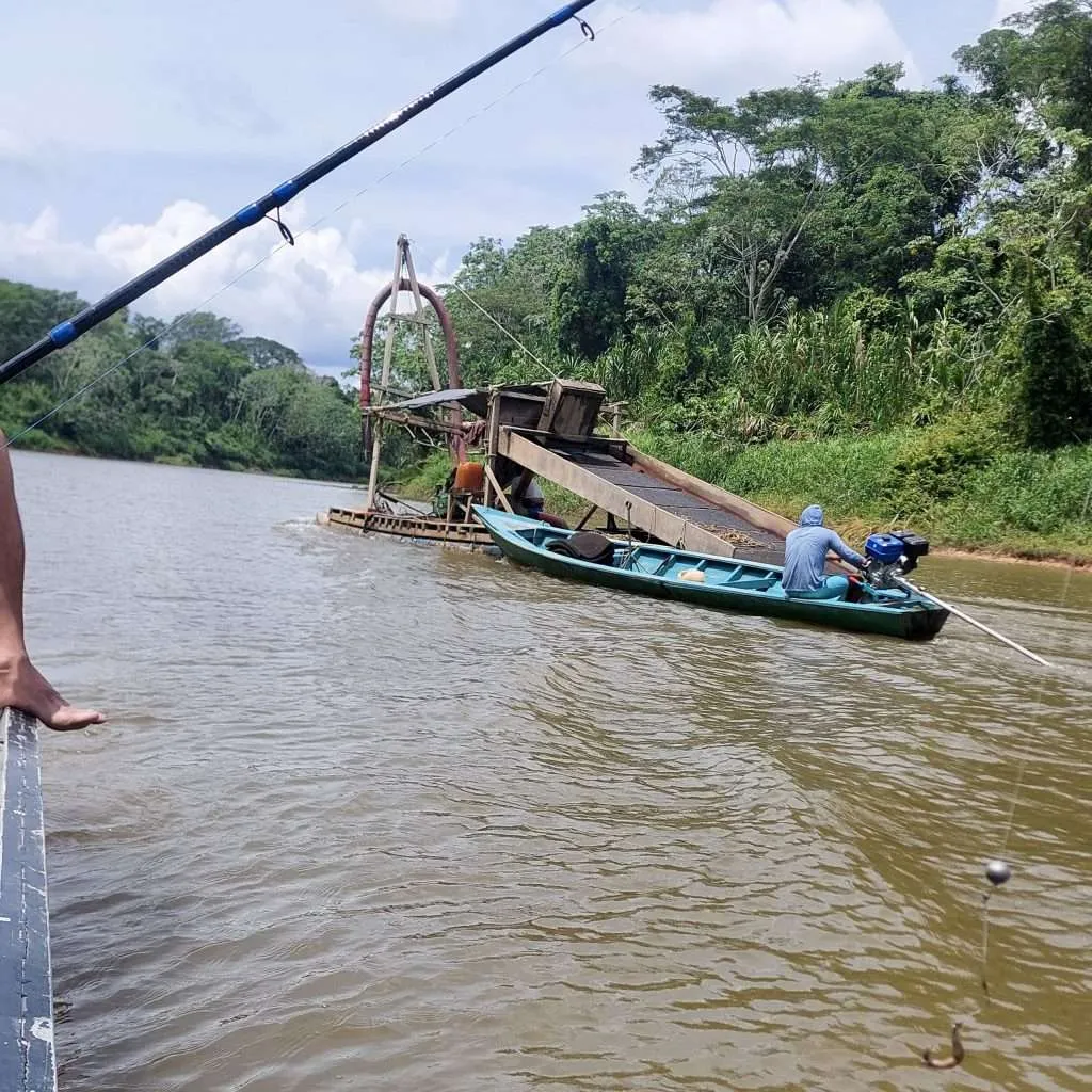 Illegal gold miners on the Heath River between Peru and Bolivia