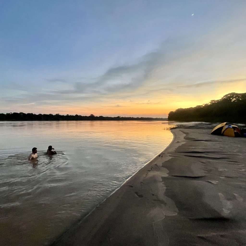 Swimming in the Madre de Dios in Tambopata after fishing all day in the Peruvian Amazon