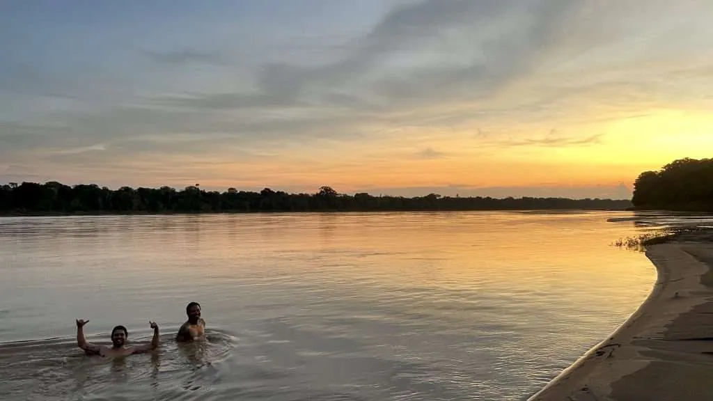 Swimming in the Madre de Dios river near Puerto Maldonado in Tambopata Peru