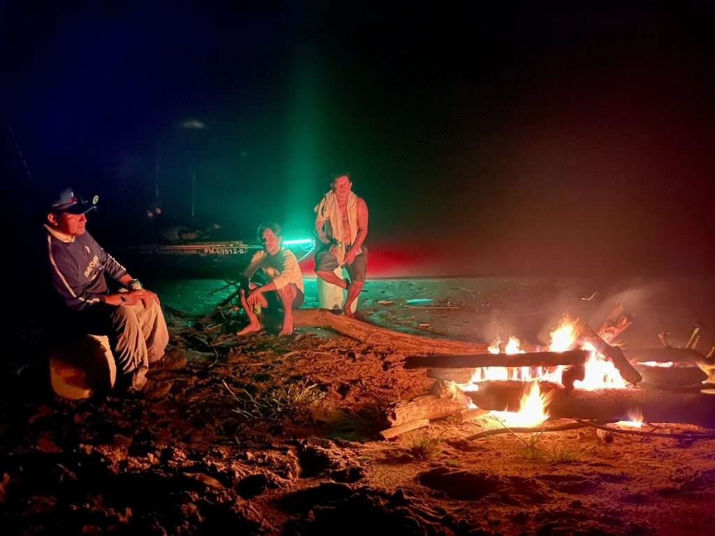 Fire on the beach at Monkey Island in Tambopata (isla de los monos)