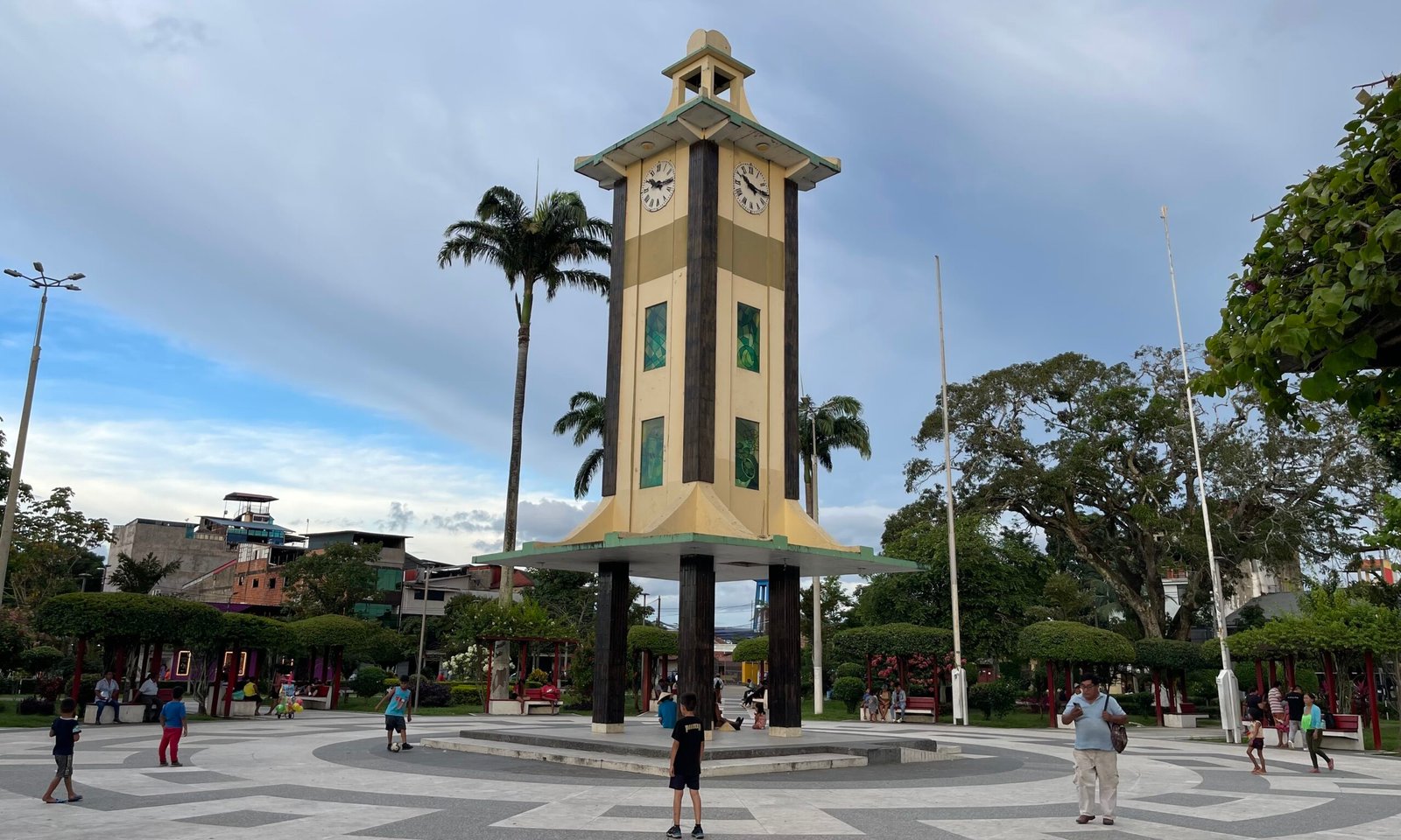 The clock tower in the center of the Plaza de Armas in Puerto Maldonado, Peru, during the day.