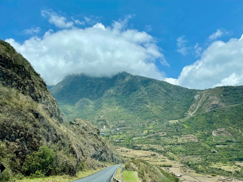 Winding road through the green mountains of the Sacred Valley near Cusco, Peru.