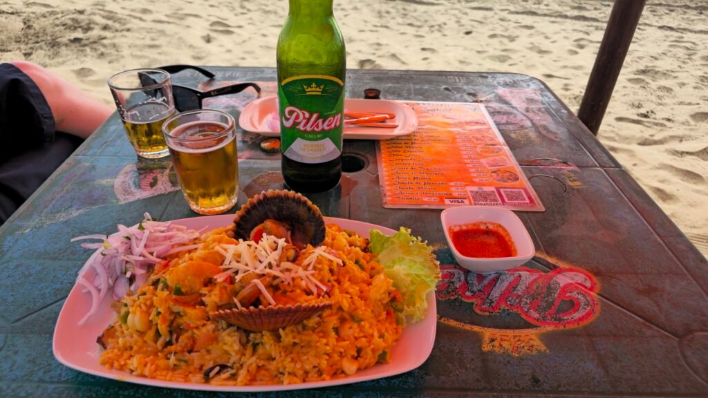A plate of fresh-caught ceviche being enjoyed at a shack on the beach in Huacho, Peru.