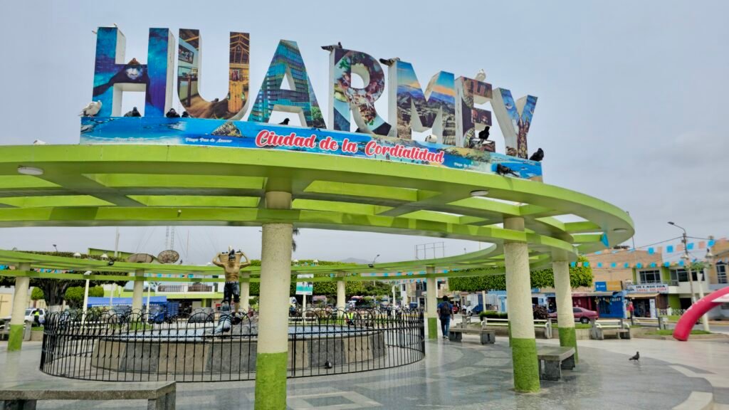 The prominent Huarmey town sign with "Ciudad de la Cordialidad" text in a public plaza in Huarmey, Peru.