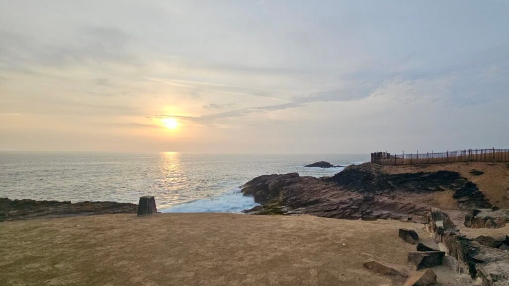 A view of a rugged coastal cove in Huarmey, Peru, where the arid desert landscape meets the Pacific Ocean.