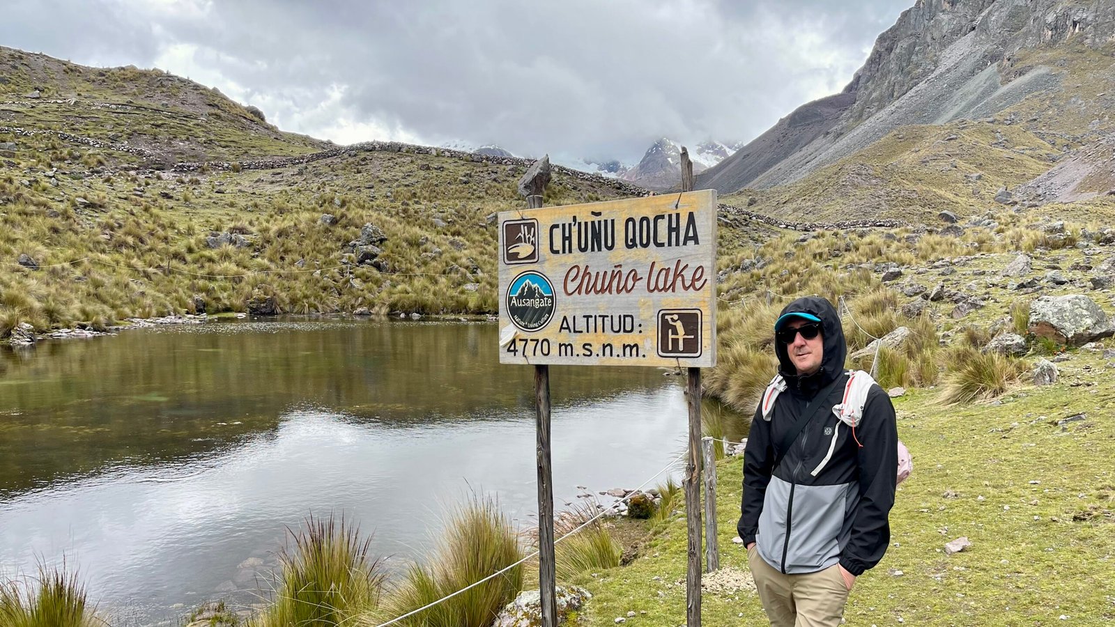 Kieran Proctor, Peru travel expert, at 4,770 meters at Chuño Lake, showcasing his deep first-hand knowledge of Peru's diverse landscapes and top travel destinations.
