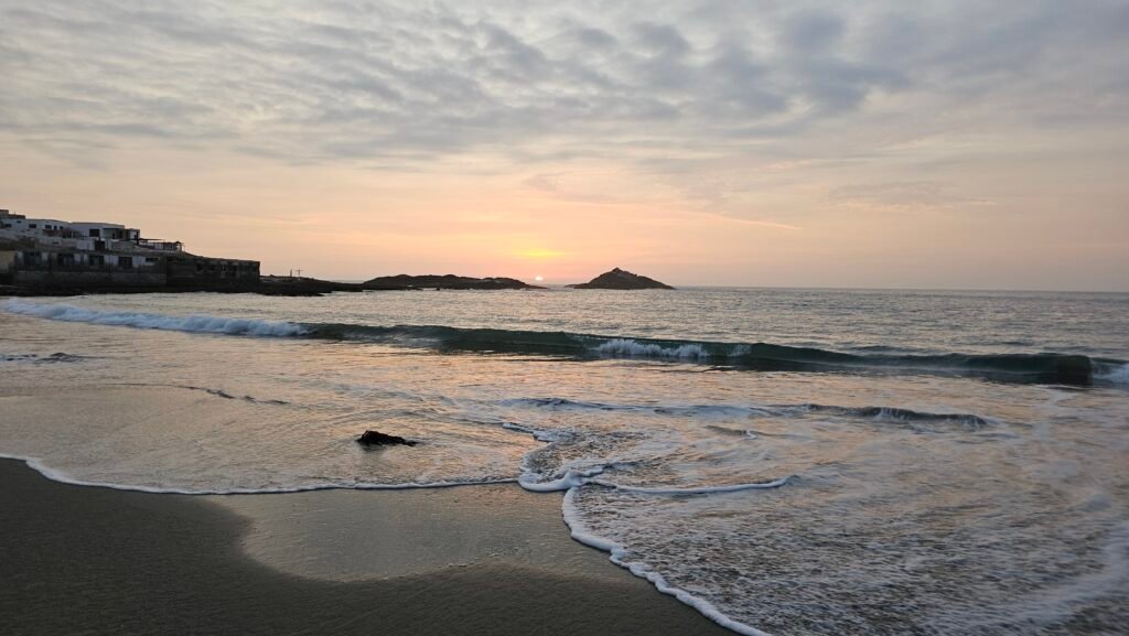 Peaceful sunset scene over the ocean at Playa Tuquillo in Huarmey, Peru.